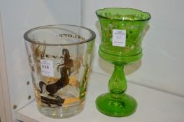 A gilded glass vase and a green glass goblet.