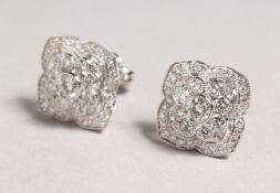 A VERY GOOD PAIR OF 18CT WHITE GOLD DECO DESIGN 1.5CT DIAMOND EARRINGS.