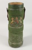 A 19TH / EARLY 20TH CENTURY GREEN PAINTED CANVAS SHELL CARRIER, with leather handle and applied coat
