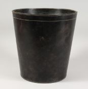 A ROUND LEATHER WASTE PAPER BIN. 12ins high.