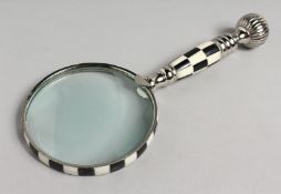 A NOVELTY MAGNIFYING GLASS with chequered and chrome handle.