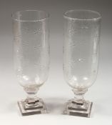A PAIR OF CUT GLASS STORM LANTERNS. 15ins high.