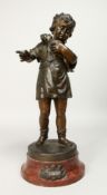 PAUL NOUL. A 19TH CENTURY BRONZE FIGURE OF A YOUNG GIRL holding a figure of Punch on a circular