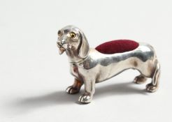 TWO SILVER DACHSHUND PINCUSHIONS.