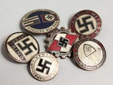 SIX REPLICA NAZI BADGES.