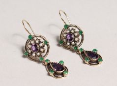 A GOOD PAIR OF SURROGATE COLOURED EMERALD, AMETHYST AND PEARL DROP EARRINGS.