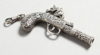 A NOVELTY SILVER PISTOL WHISTLE.