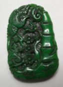 A LARGE CHINESE CARVED JADE PENDANT. 3.5ins x 2ins.