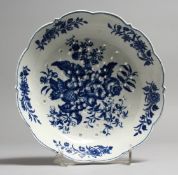 AN 18TH CENTURY WORCESTER RARE CRESS DRAIN OR CHEESE DRAINER, decorated with fir cone and floral