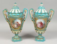 A VERY GOOD PAIR OF 19TH CENTURY SEVRES PORCELAIN TWO HANDLED URNS AND COVERS, turquoise ground