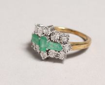 A GOOD 9CT GOLD, DIAMOND AND EMERALD RING.