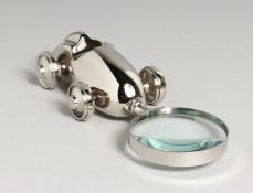 A NOVELTY NICKEL CAR MAGNIFYING GLASS.