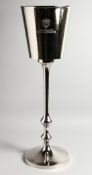 A SILVER PLATE BOLLINGER COOLER ON STAND.
