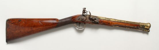 AN 18TH CENTURY BRASS BARREL FLINTLOCK BLUNDERBUSS, with mahogany stock barrel, 12 ins long, by
