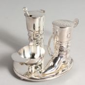 A SILVER PLATE RIDING BOOT CRUET.