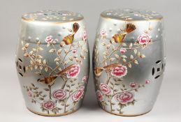 A PAIR OF SILVERED CHINESE PORCELAIN BARREL SEATS with flowers and birds. 17.5ins high.