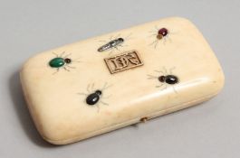A GOOD IVORY CASED NECESSAIRE with scissors, thimble etc., with insects on the lid. 4.25ins x 2.