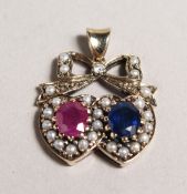 A 9CT GOLD, RUBY, SAPPHIRE, PEARL AND DIAMOND SWEETHEART PENDANT.