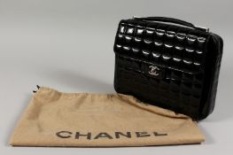 A USED CHANEL BLACK LAMINATED BAG. No. 738143, in a dust bag.