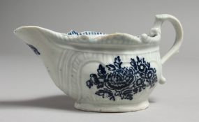 AN 18TH CENTURY LIVERPOOL CREAMBOAT, with biting snake handle and moulded cartouches decorated