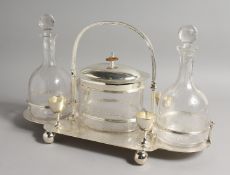 A GOOD PLATE DECANTER AND BISCUIT STAND with a pair of glass decanters and stoppers, and four cups.