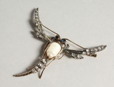 AN 18CT GOLD BAROQUE PEARL AND DIAMOND DRAGONFLY BROOCH.