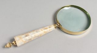 A NOVELTY MAGNIFYING GLASS with mother-of-pearl handle.