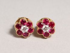 A GOOD PAIR OF 18CT YELLOW GOLD, RUBY AND DIAMOND CLUSTER EARRINGS.