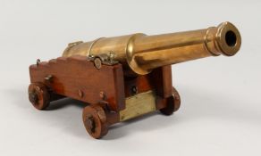 A HISTORICAL WOOD AND BRASS CANNON, made from the wood and brass belonging to HMS EURYDICE, which