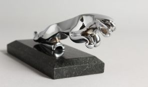 A CHROME JAGUAR MASCOT on a marble base.
