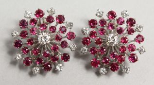 A GOOD PAIR OF 18CT GOLD, DIAMOND AND RUBY STARBURST EARRINGS.
