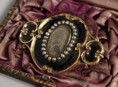 A MOURNING BROOCH, inscribed 14th September 1852, Augustus W. Pugin, the front with black enamel,