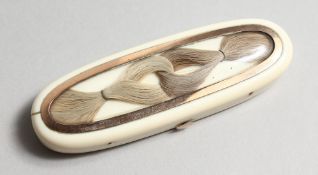 A GEORGIAN IVORY AND GOLD TOOTHPICK CASE, the top inset with plaited hair, the inside with a mirror.