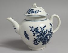 A WORCESTER BLUE AND WHITE PORCELAIN TEAPOT, the cover with floral knop, the body painted with