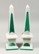 A PAIR OF TWO-COLOUR MARBLE OBELISKS on square bases. 16.5ins high.