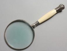 A LARGE IVORY SILVER MOUNTED MAGNIFYING GLASS.