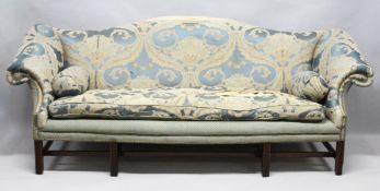 A LARGE GEORGE III DESIGN MAHOGANY SOFA, early 20th century, with a hump back, scroll end, on carved