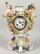 A 19TH CENTURY DRESDEN PORCELAIN CLOCK with cupids encrusted with flowers 14ins high.