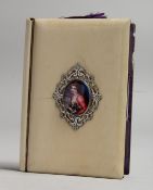 AN IVORY PURSE with enamel portrait of a lady and blue interior. 4ins x 2.75ins.