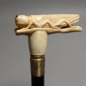 A WALKING STICK with bone handle, 