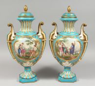 A VERY GOOD PAIR OF 19TH CENTURY SEVRES PORCELAIN TWO HANDLED URNS AND COVERS, turquoise ground