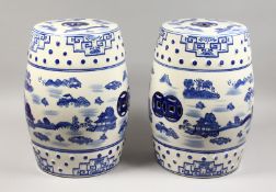 A PAIR OF CHINESE BLUE AND WHITE BARREL SEATS. 18ins high.