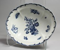 AN 18TH CENTURY DISH OF VERY RARE SHAPE, with feather-like moulded border decorated with flowers and