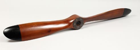 A WOODEN PROPELLER. 40ins long.