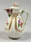 A GOOD MEISSEN RIBBED JUG AND COVER painted with flowers. Cross swords mark in blue 5.5ins high.