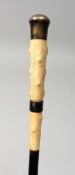 A VICTORIAN BONE HANDLED CANE with silver band and top. 33ins long.