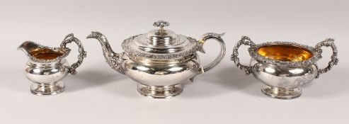 A GOOD GEORGIAN PLATE CIRCULAR SHAPED THREE-PIECE TEA SET, the sides cast with scrolls and