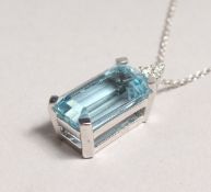 A VERY GOOD WHITE GOLD, 7CT AQUAMARINE AND DIAMOND PENDANT on chain.