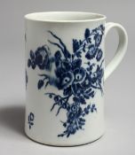 AN 18TH CENTURY WORCESTER MUG decorated with two large floral sprays, crescent mark.