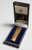 A LADIES’ GILT DUNHILL LIGHTER with paper in original box.